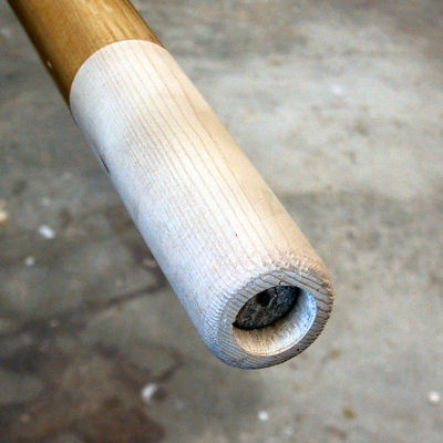 Oar handle with lead insert before plugging end